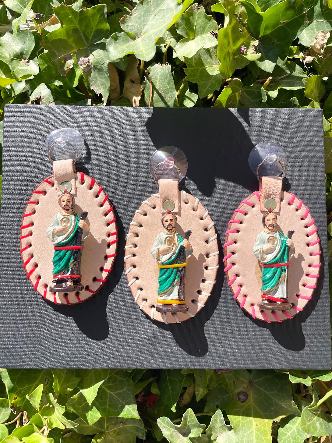 Close up San Judas Tadeo car hanging accessory inspired by Mexican faith and culture