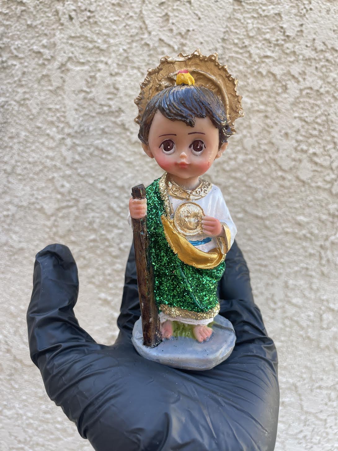 Close up of San Judas statue detailed Mexican religious decor figure